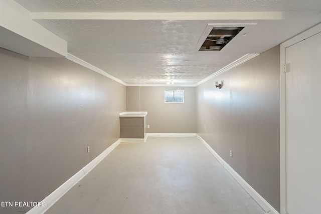 basement featuring crown molding and a textured ceiling