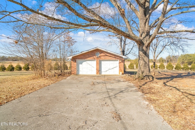 exterior space with an outbuilding and a garage