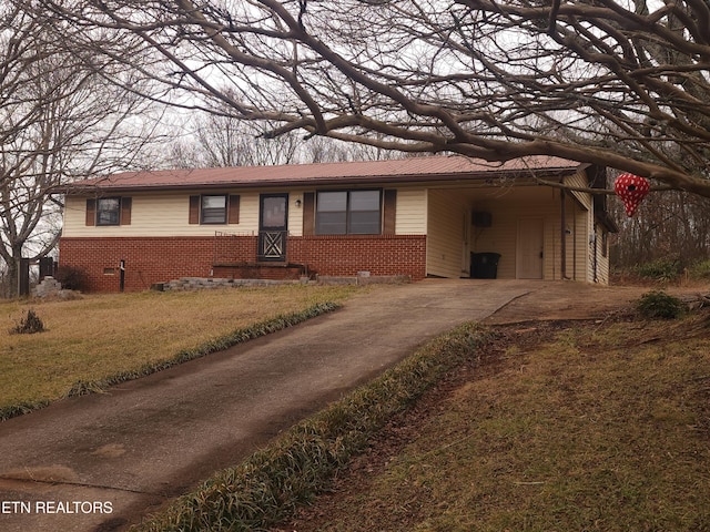 single story home featuring a front yard and a carport