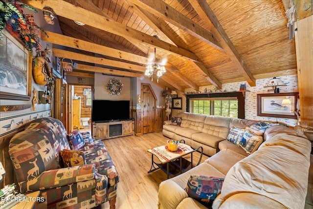 living room featuring wood walls, wood ceiling, vaulted ceiling with beams, light hardwood / wood-style flooring, and ceiling fan