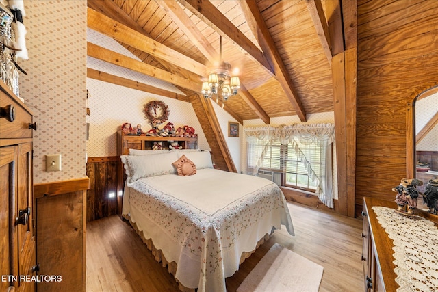 bedroom featuring wood ceiling, light hardwood / wood-style floors, lofted ceiling with beams, and wood walls