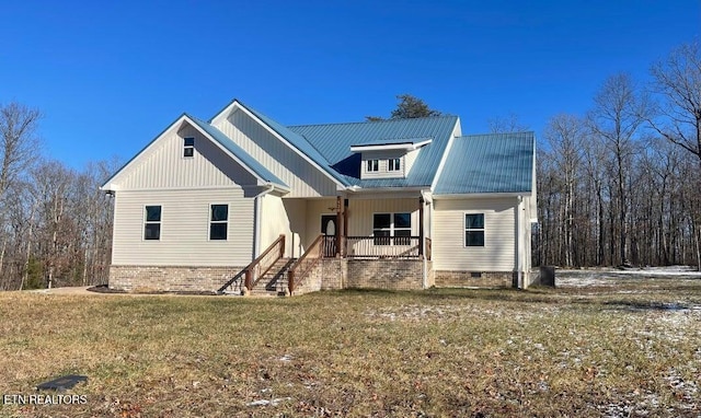 view of front facade with covered porch and a front lawn