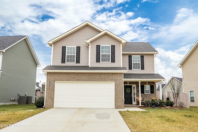 view of front facade featuring a garage, cooling unit, and a front lawn