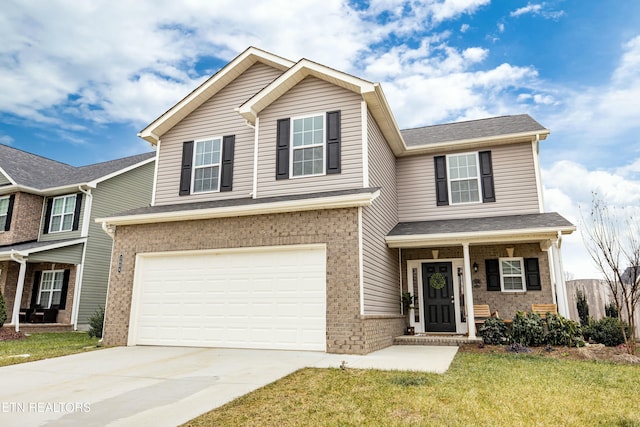 view of front of home featuring a front yard and a garage