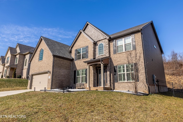 view of front of property featuring a garage and a front lawn