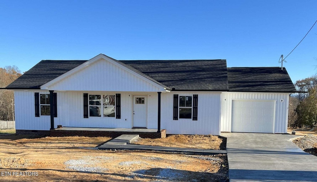 view of front facade featuring a garage and covered porch