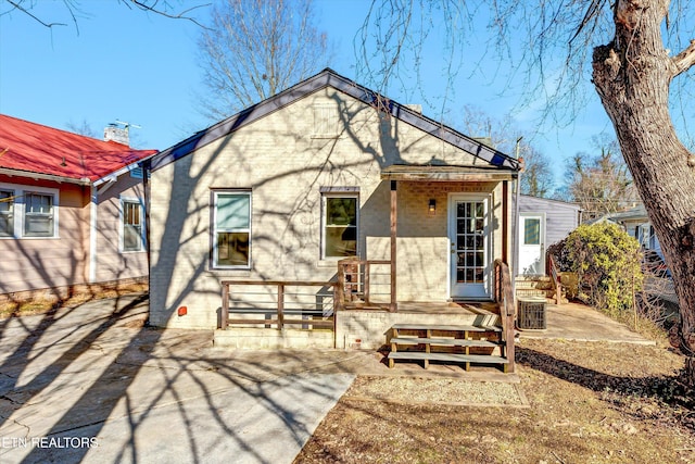 back of house featuring a patio and central air condition unit