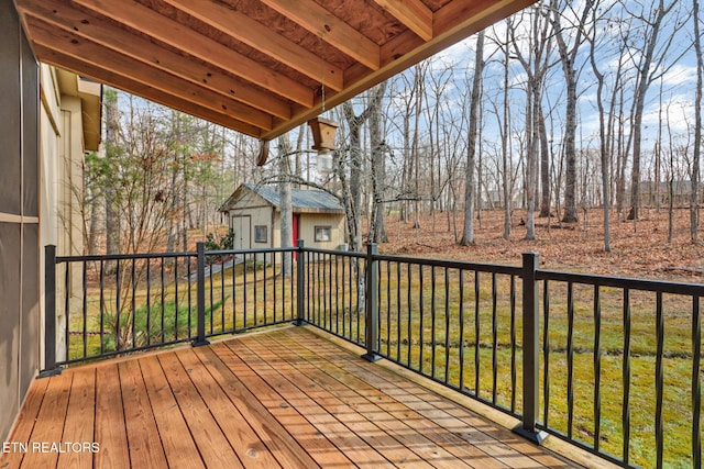 wooden terrace with a yard