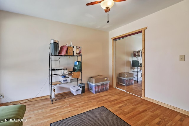 misc room featuring ceiling fan and hardwood / wood-style floors