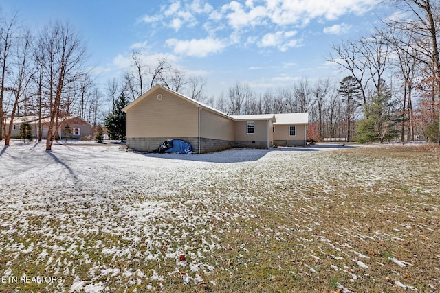 view of snow covered property