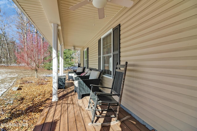 deck with ceiling fan and covered porch