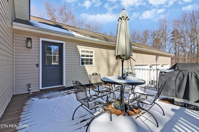 view of snow covered patio