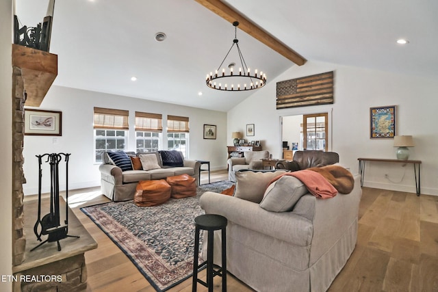 living room featuring light hardwood / wood-style flooring and vaulted ceiling with beams