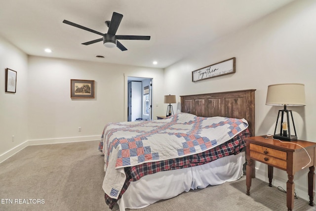 bedroom featuring ceiling fan and light carpet