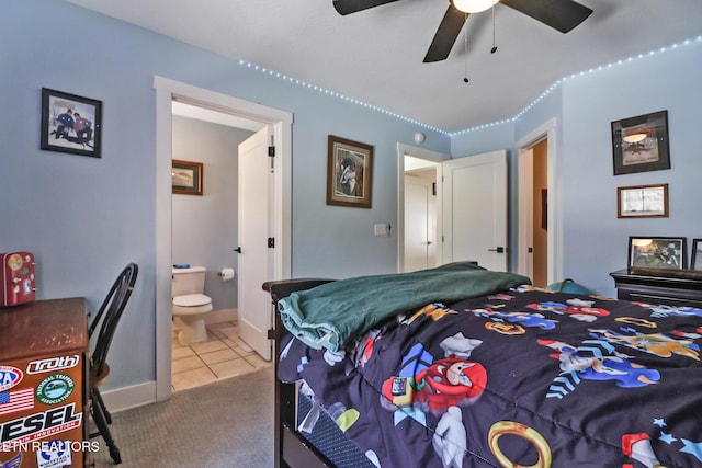 carpeted bedroom featuring ceiling fan and connected bathroom