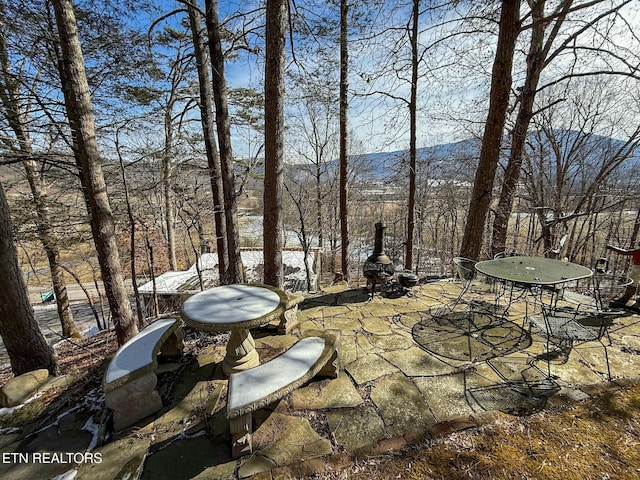 view of patio / terrace featuring a mountain view