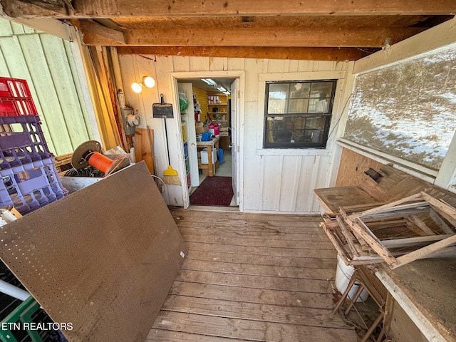 miscellaneous room featuring hardwood / wood-style flooring and beam ceiling