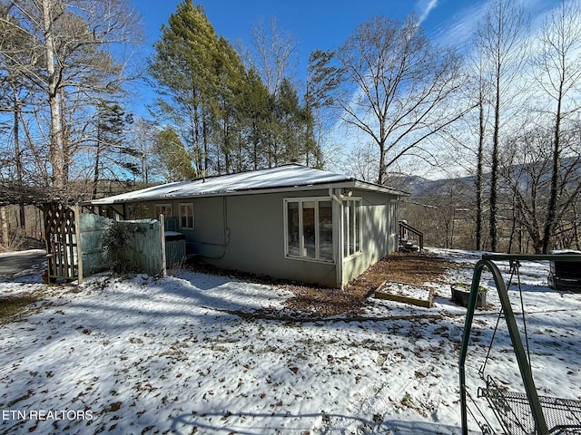 snow covered property with a mountain view