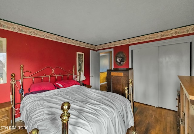 bedroom with a closet and wood finished floors