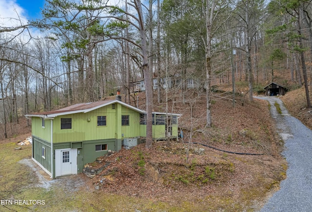 view of side of property featuring driveway