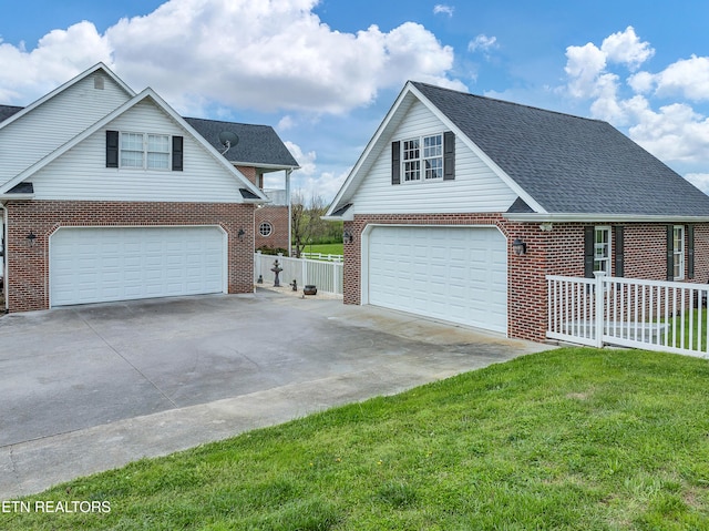 front facade featuring a garage and a front lawn