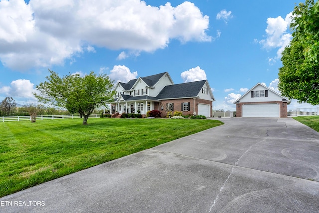 cape cod house with a garage and a front yard