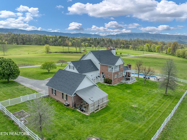 bird's eye view featuring a mountain view and a rural view