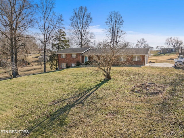 ranch-style house with a front yard