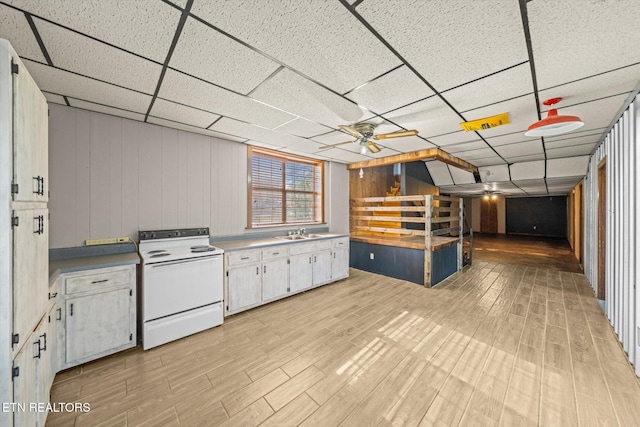 kitchen featuring white cabinetry, sink, a paneled ceiling, and white electric stove