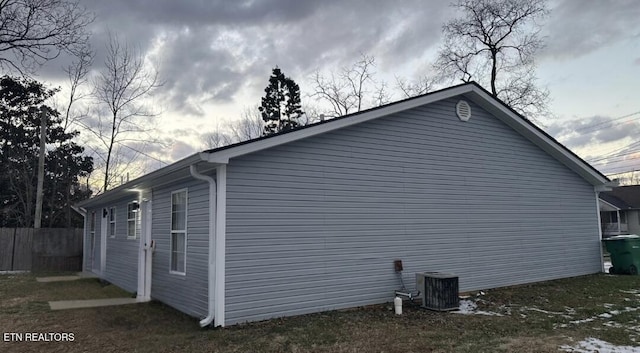 view of side of property with cooling unit