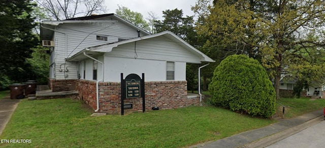 view of property exterior with a yard