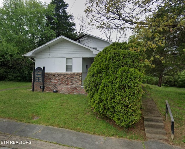 view of home's exterior featuring a lawn