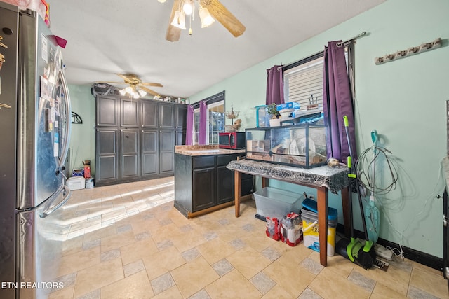 kitchen featuring stainless steel fridge and ceiling fan