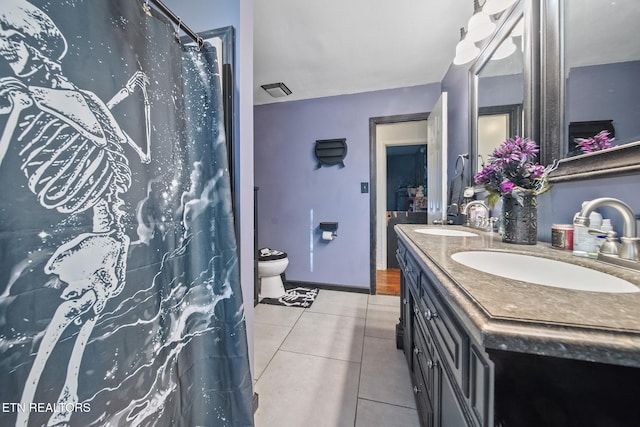 bathroom featuring vanity, tile patterned floors, toilet, and a shower with shower curtain