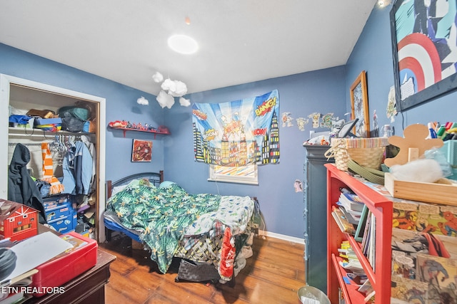 bedroom with wood-type flooring