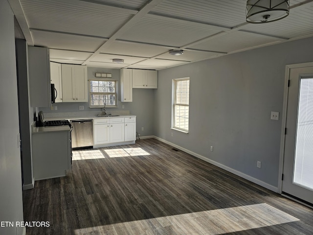 kitchen featuring white cabinetry, dishwasher, sink, stove, and dark wood-type flooring