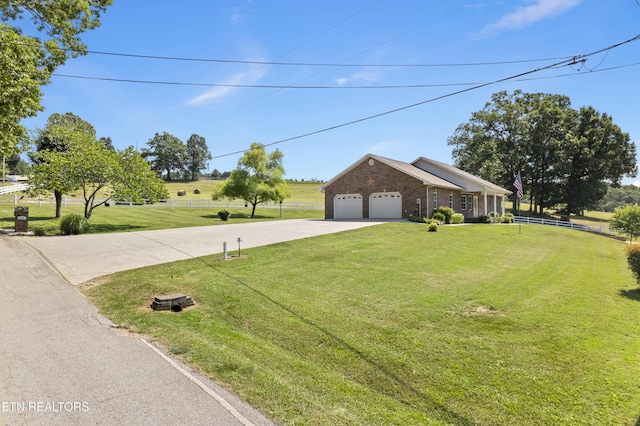 view of front of house with a garage and a front lawn