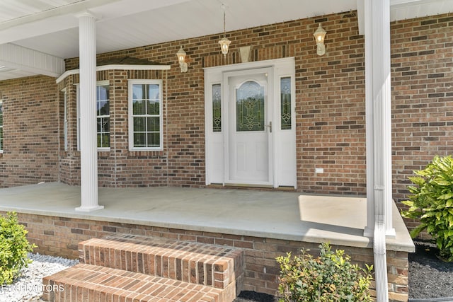 property entrance featuring a porch