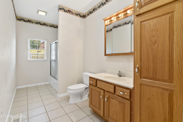 full bathroom featuring bath / shower combo with glass door, tile patterned floors, vanity, and toilet