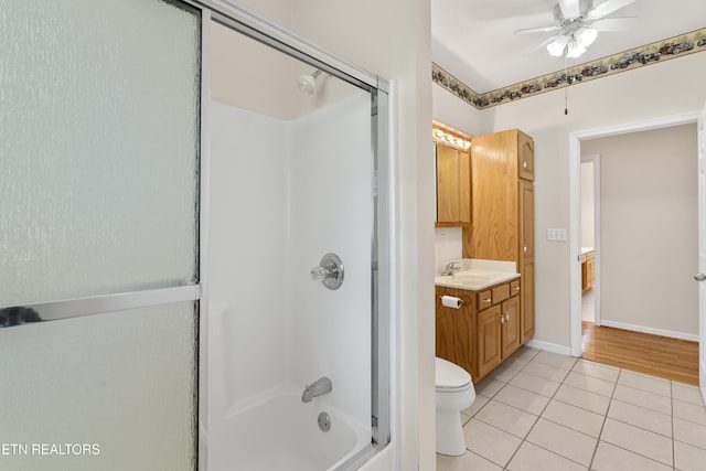 full bathroom with tile patterned floors, vanity, toilet, ceiling fan, and combined bath / shower with glass door