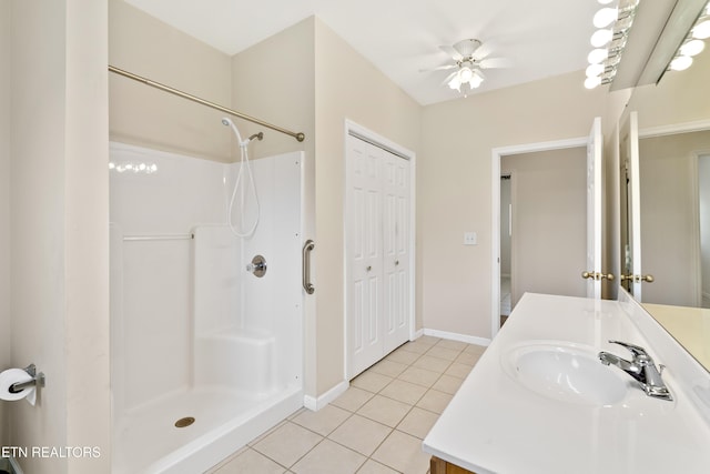 bathroom with vanity, walk in shower, and tile patterned flooring