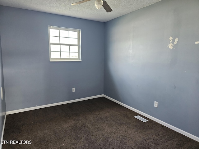 unfurnished room with ceiling fan, carpet flooring, and a textured ceiling