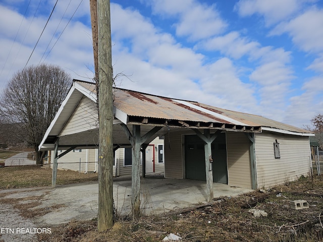 rear view of house featuring a carport