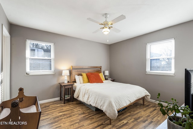 bedroom featuring dark hardwood / wood-style floors and ceiling fan