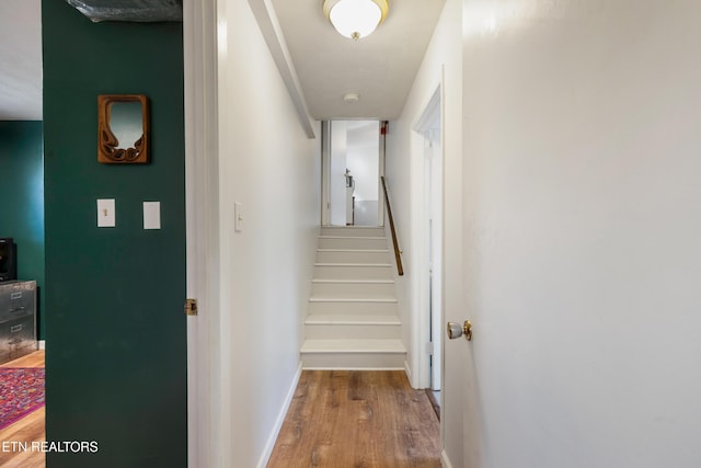 corridor with wood-type flooring