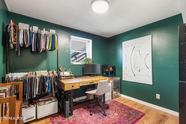 office space with wood-type flooring