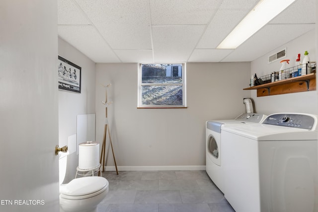 laundry room featuring washing machine and dryer