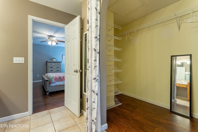 walk in closet with tile patterned floors