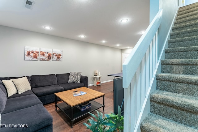 living room featuring dark wood-type flooring