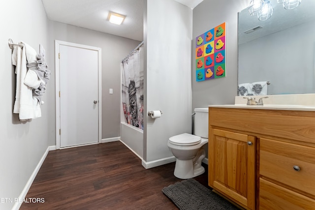 full bathroom featuring vanity, wood-type flooring, toilet, and shower / bathtub combination with curtain